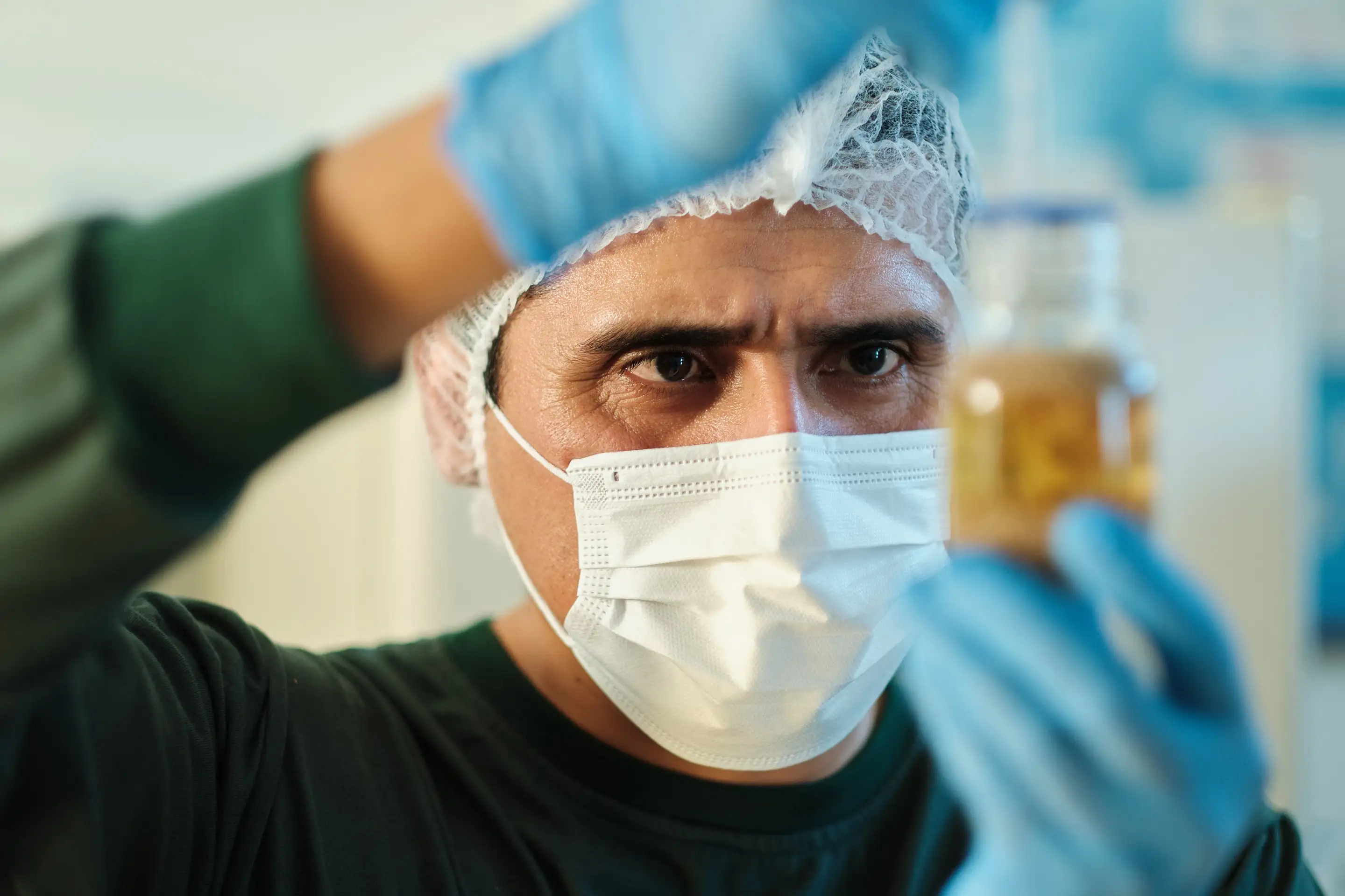 A Benexia scientist examining a chia sample against the light